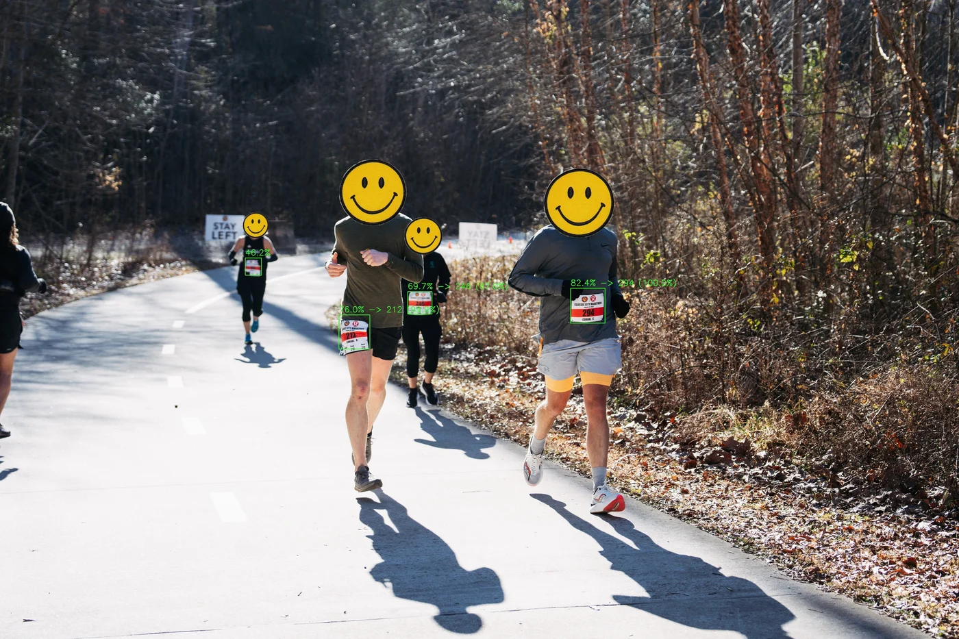 Image of marathon runners with number bibs being detected by artificial intelligence